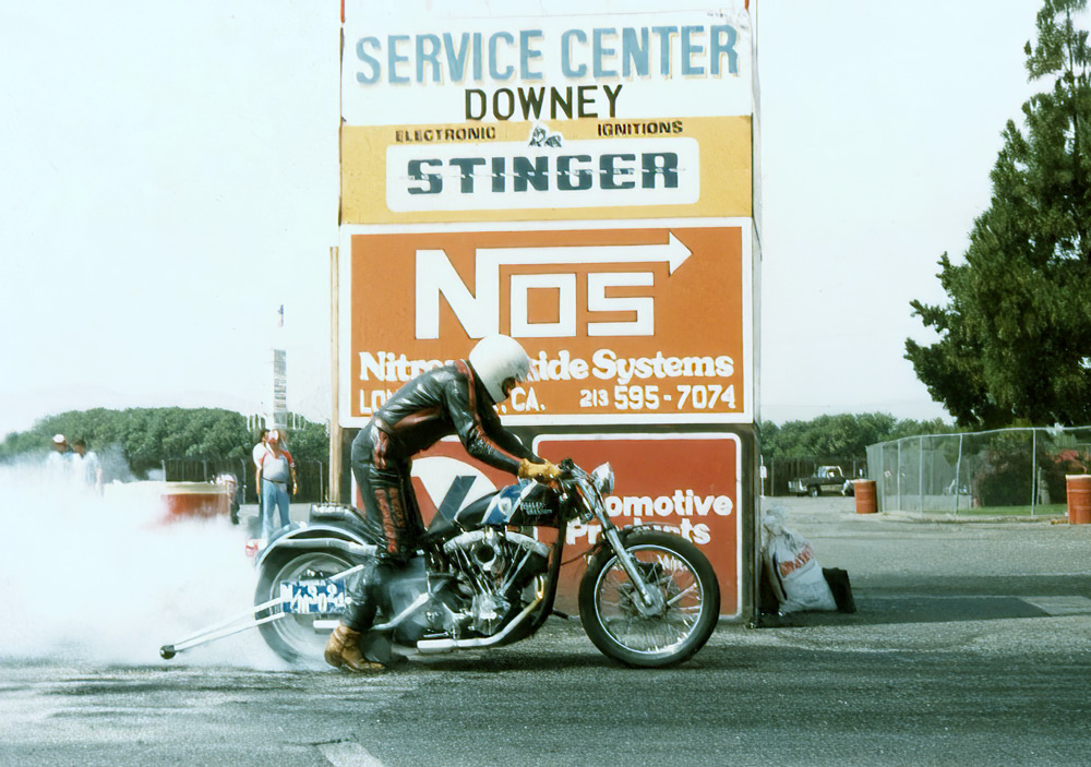 Dave Mackie burning rubber on his Harley-Davidson drag bike.